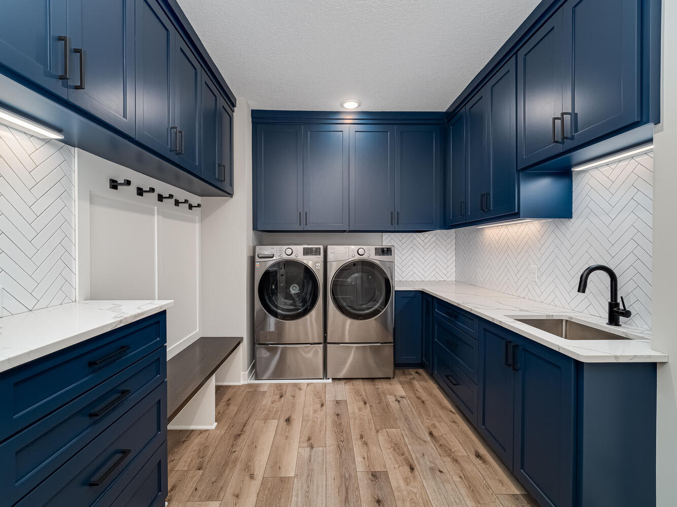 Modern blue and white washroom in a custom home